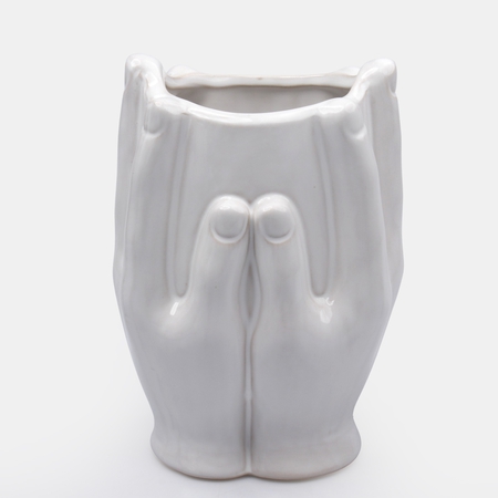 White ceramic vase Hands